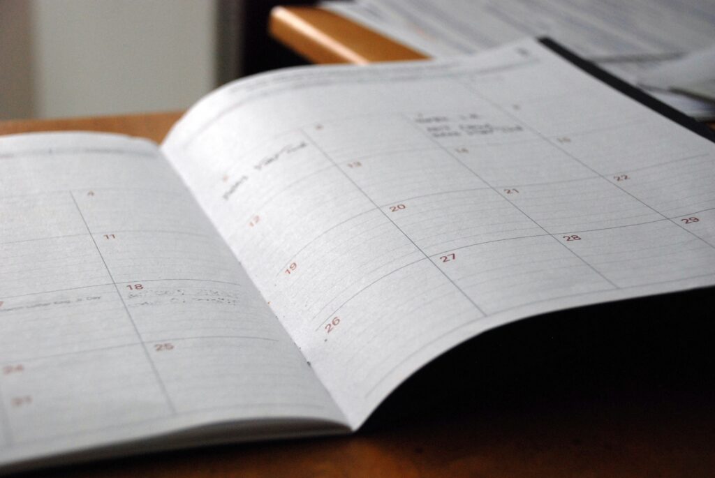HR manager tracking intermittent FMLA leave on a desk calendar for compliance purposes