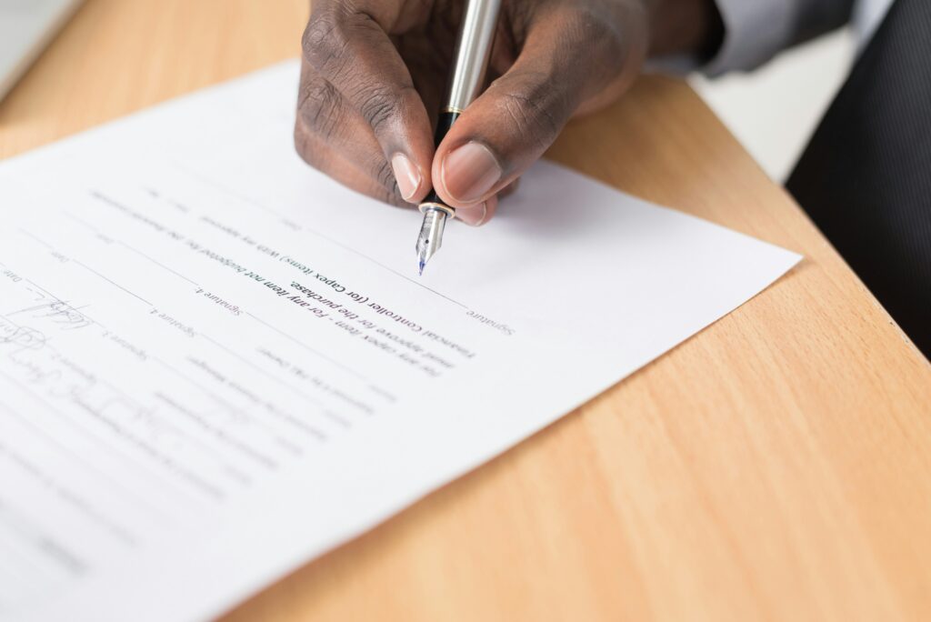 HR manager organizing FMLA documentation and employer required leave forms